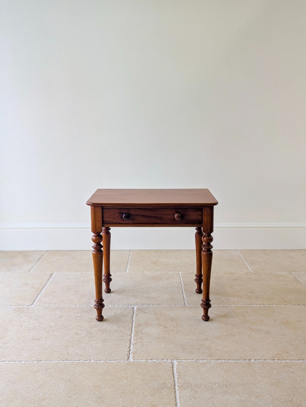 A late Victorian mahogany side table featuring a rectangular top, single drawer with two turned wooden knobs, and four turned legs. View VII