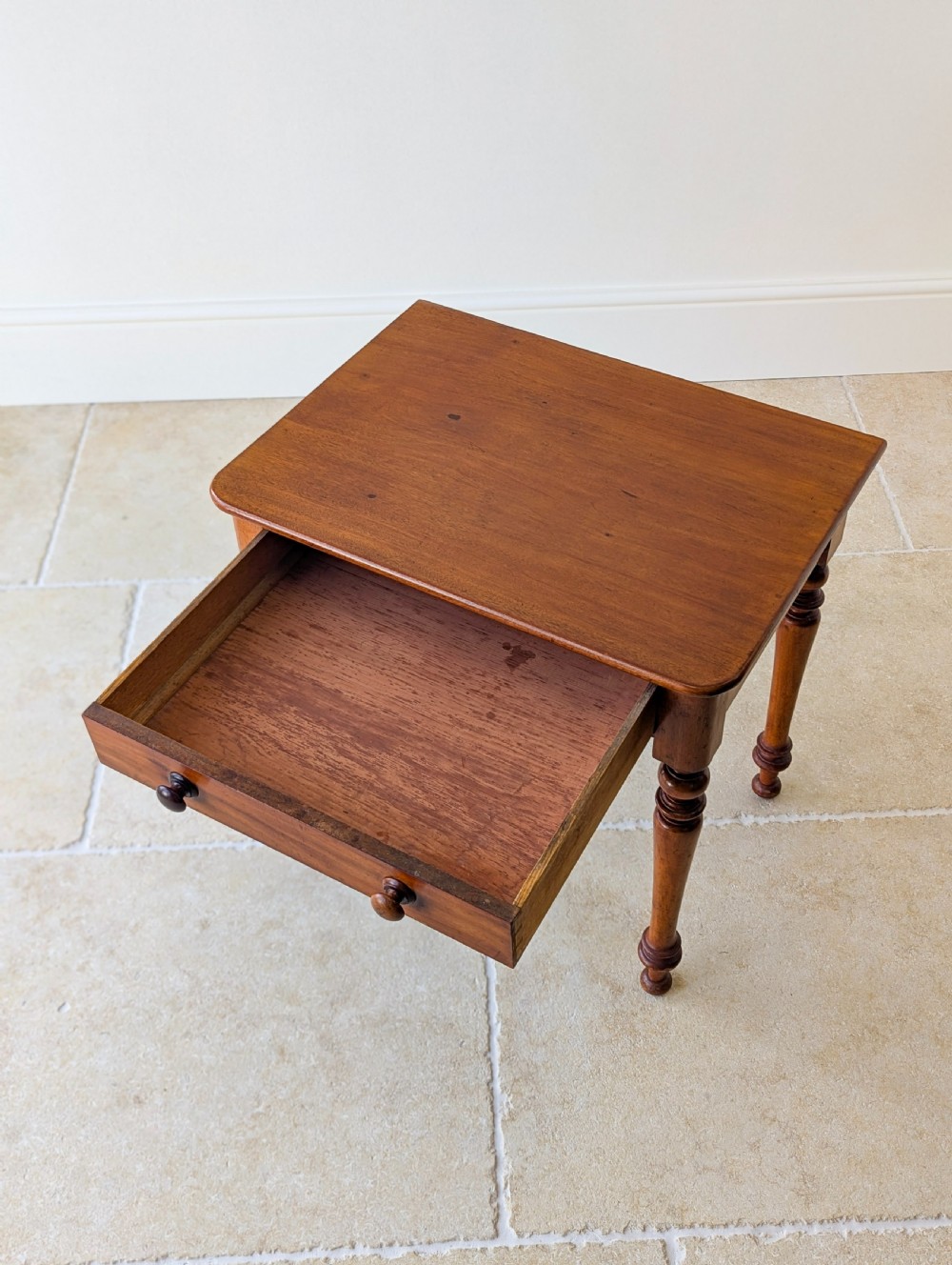 A late Victorian mahogany side table featuring a rectangular top, single drawer with two turned wooden knobs, and four turned legs. View VIII