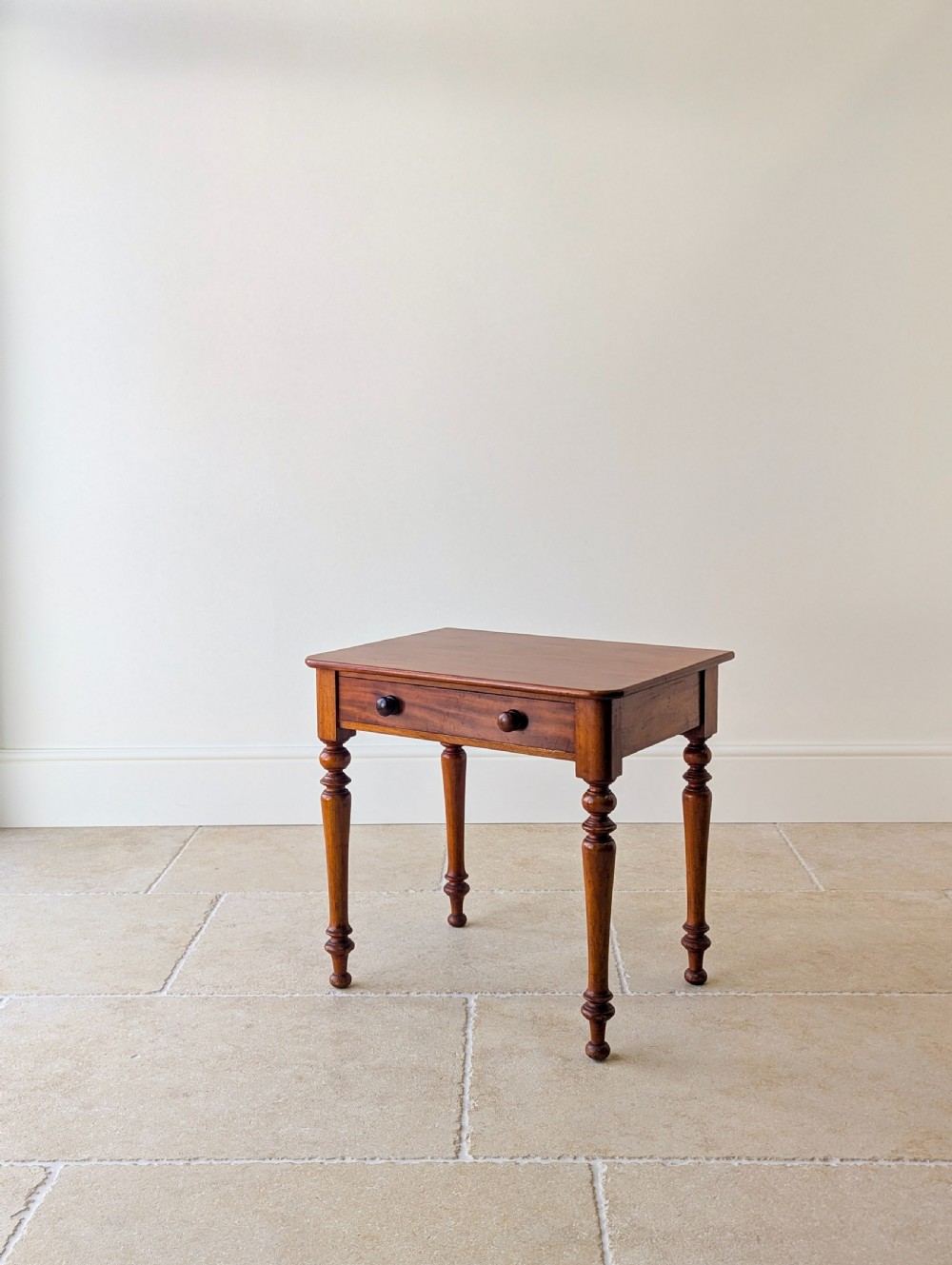 A late Victorian mahogany side table featuring a rectangular top, single drawer with two turned wooden knobs, and four turned legs. View IX