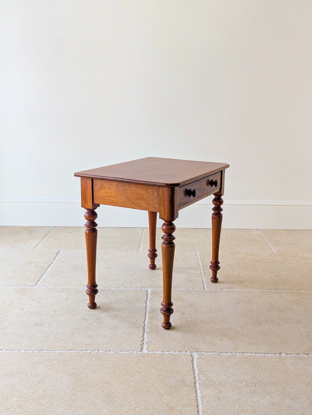A late Victorian mahogany side table featuring a rectangular top, single drawer with two turned wooden knobs, and four turned legs. View XII