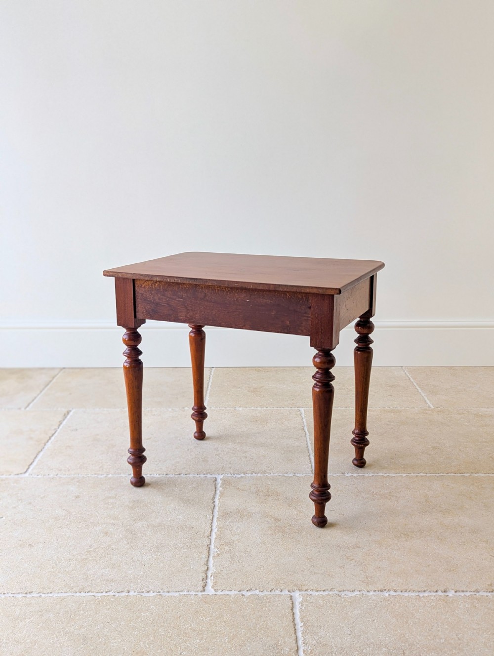 A late Victorian mahogany side table featuring a rectangular top, single drawer with two turned wooden knobs, and four turned legs. View XIV