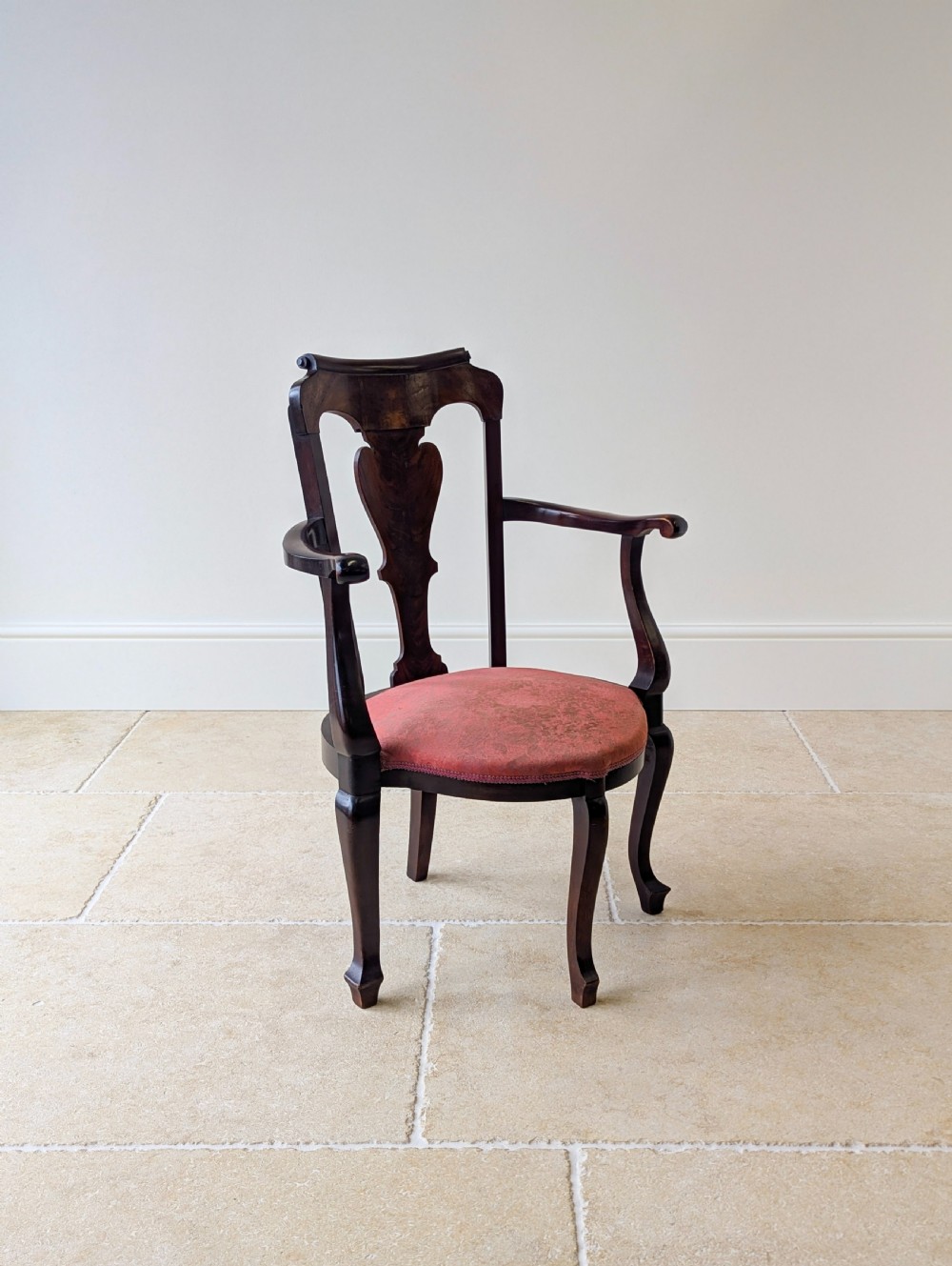 An antique mid-18th century Georgian open armchair crafted from dark mahogany wood featuring a shaped back splat, curved armrests, cabriole front legs, and a red patterned fabric seat. View VII