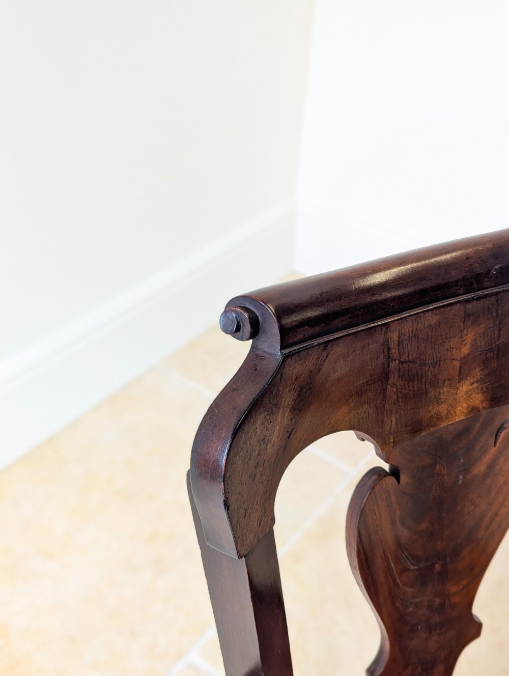 An antique mid-18th century Georgian open armchair crafted from dark mahogany wood featuring a shaped back splat, curved armrests, cabriole front legs, and a red patterned fabric seat. View VIII