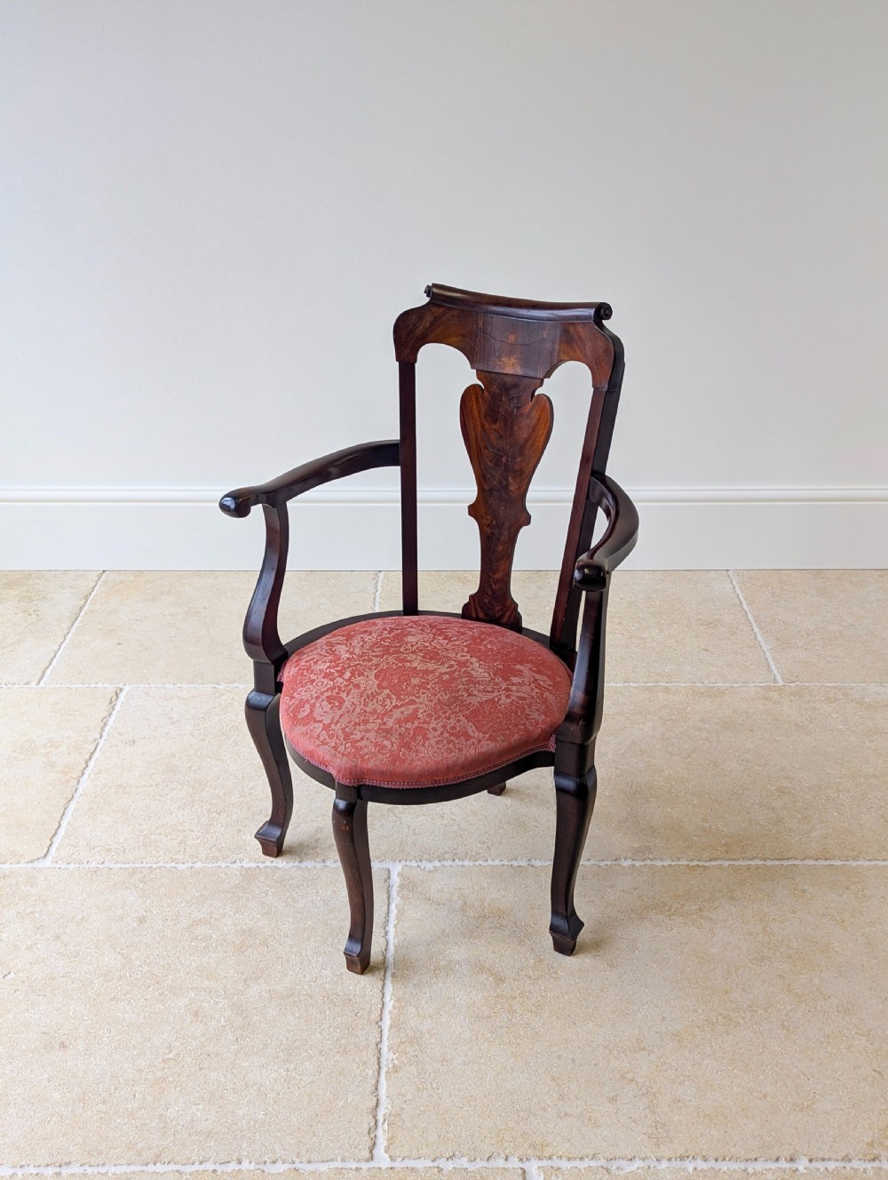 An antique mid-18th century Georgian open armchair crafted from dark mahogany wood featuring a shaped back splat, curved armrests, cabriole front legs, and a red patterned fabric seat. View IX