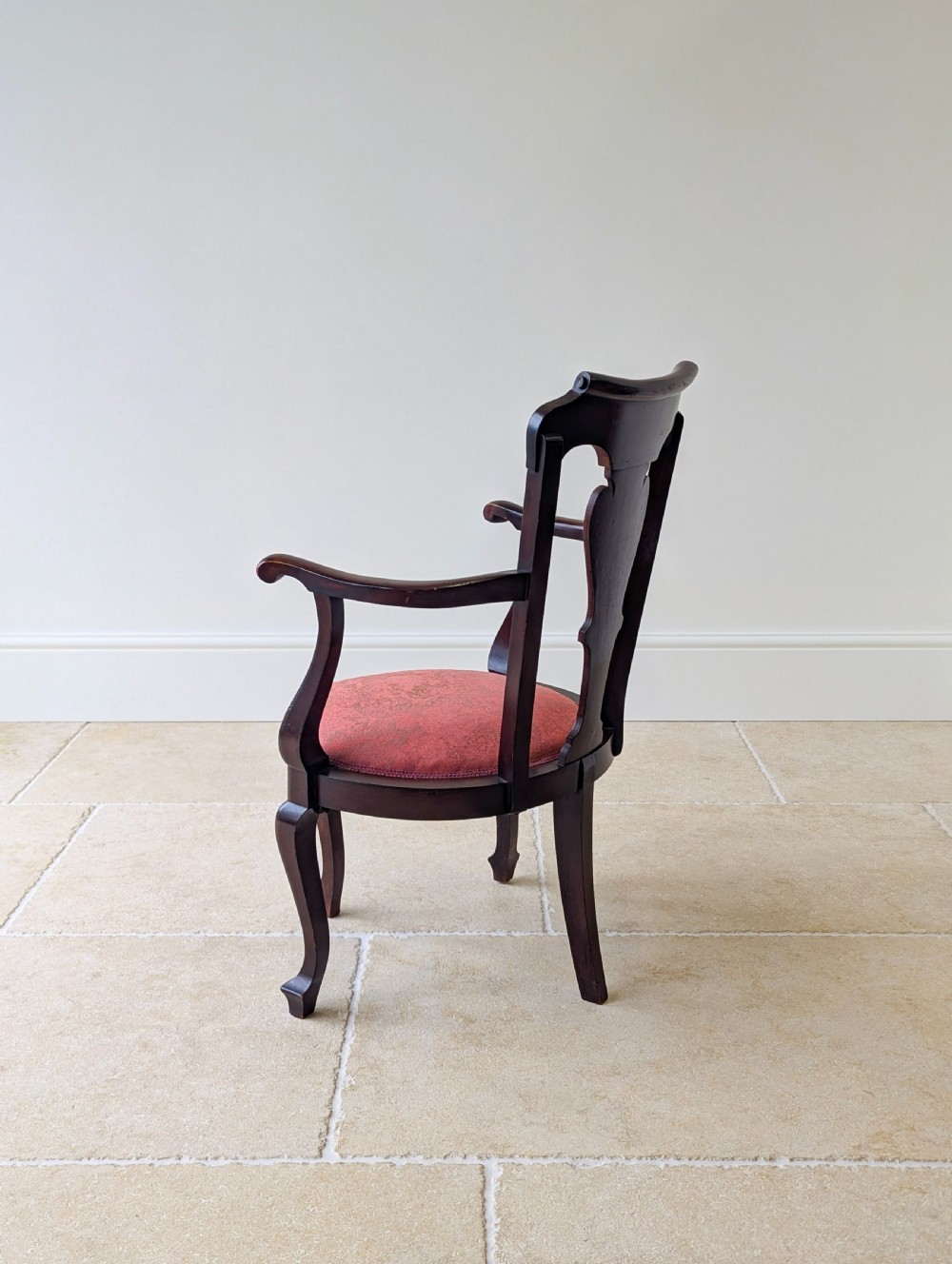 An antique mid-18th century Georgian open armchair crafted from dark mahogany wood featuring a shaped back splat, curved armrests, cabriole front legs, and a red patterned fabric seat. View XII