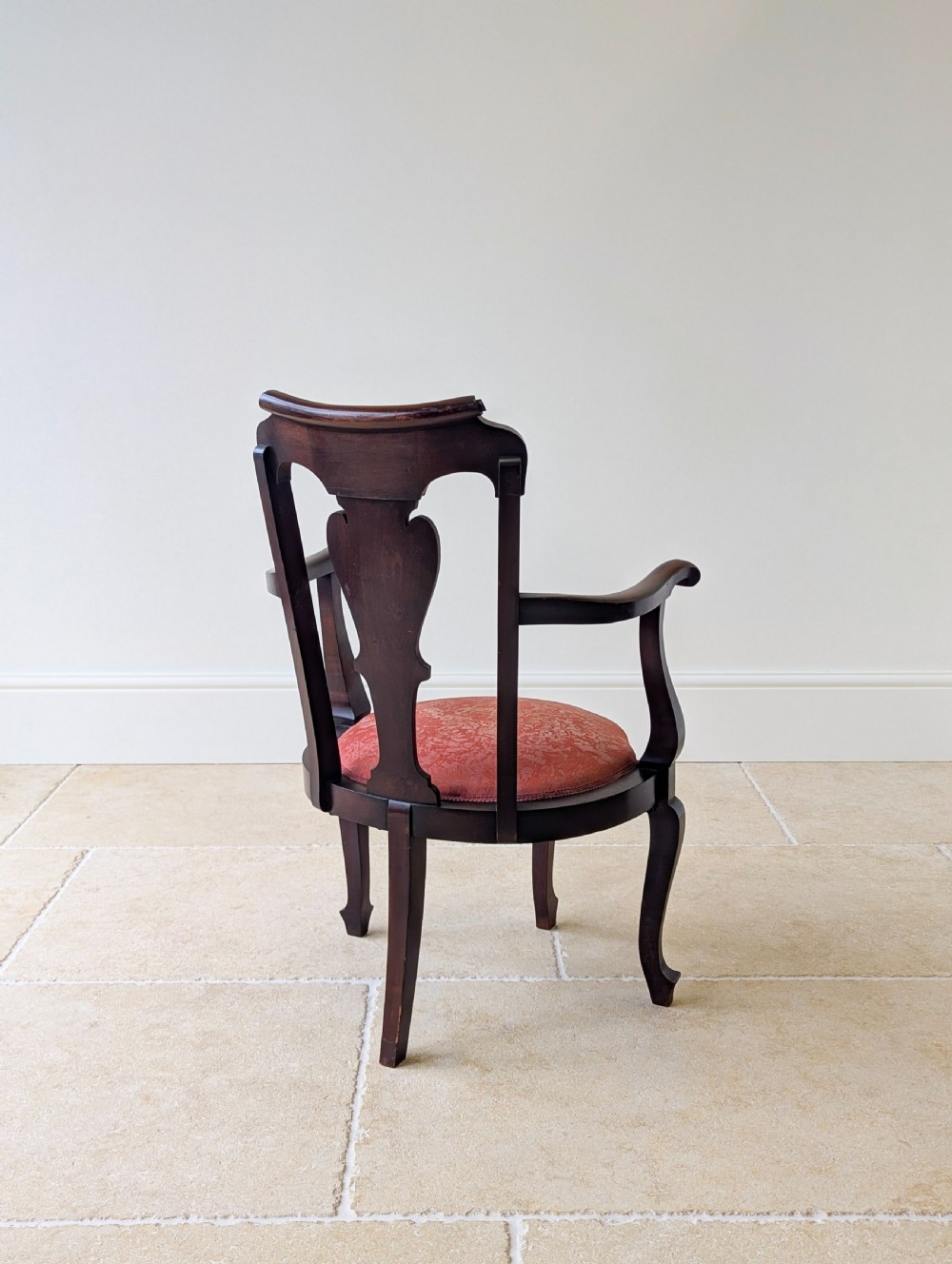 An antique mid-18th century Georgian open armchair crafted from dark mahogany wood featuring a shaped back splat, curved armrests, cabriole front legs, and a red patterned fabric seat. View XIII