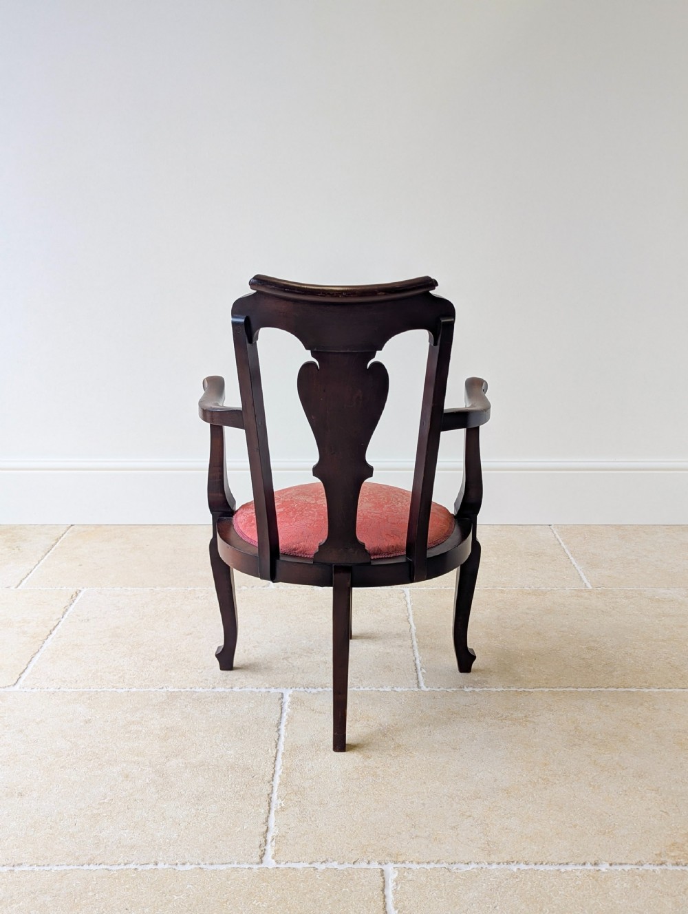 An antique mid-18th century Georgian open armchair crafted from dark mahogany wood featuring a shaped back splat, curved armrests, cabriole front legs, and a red patterned fabric seat. View XIV