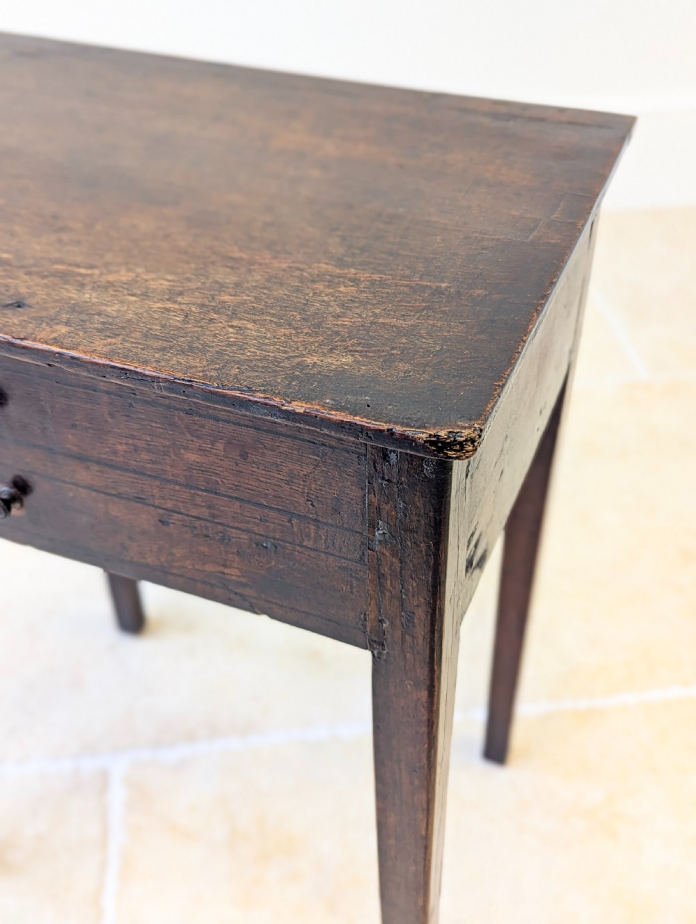 An antique Georgian dark oak work table featuring two drawers, straight square legs, and a rectangular top surface. View IV