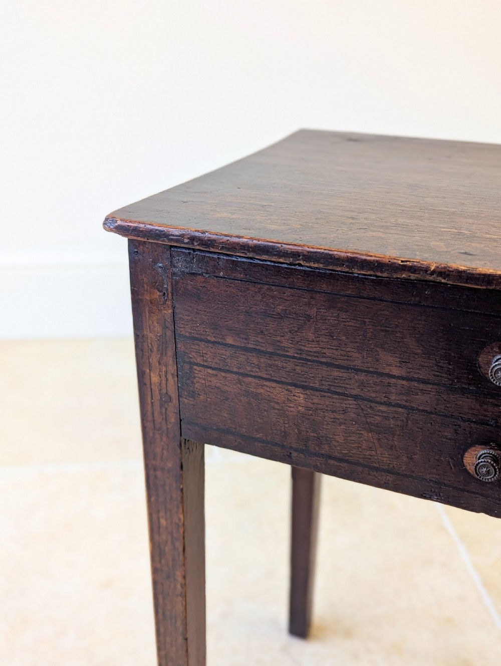 An antique Georgian dark oak work table featuring two drawers, straight square legs, and a rectangular top surface. View VIII