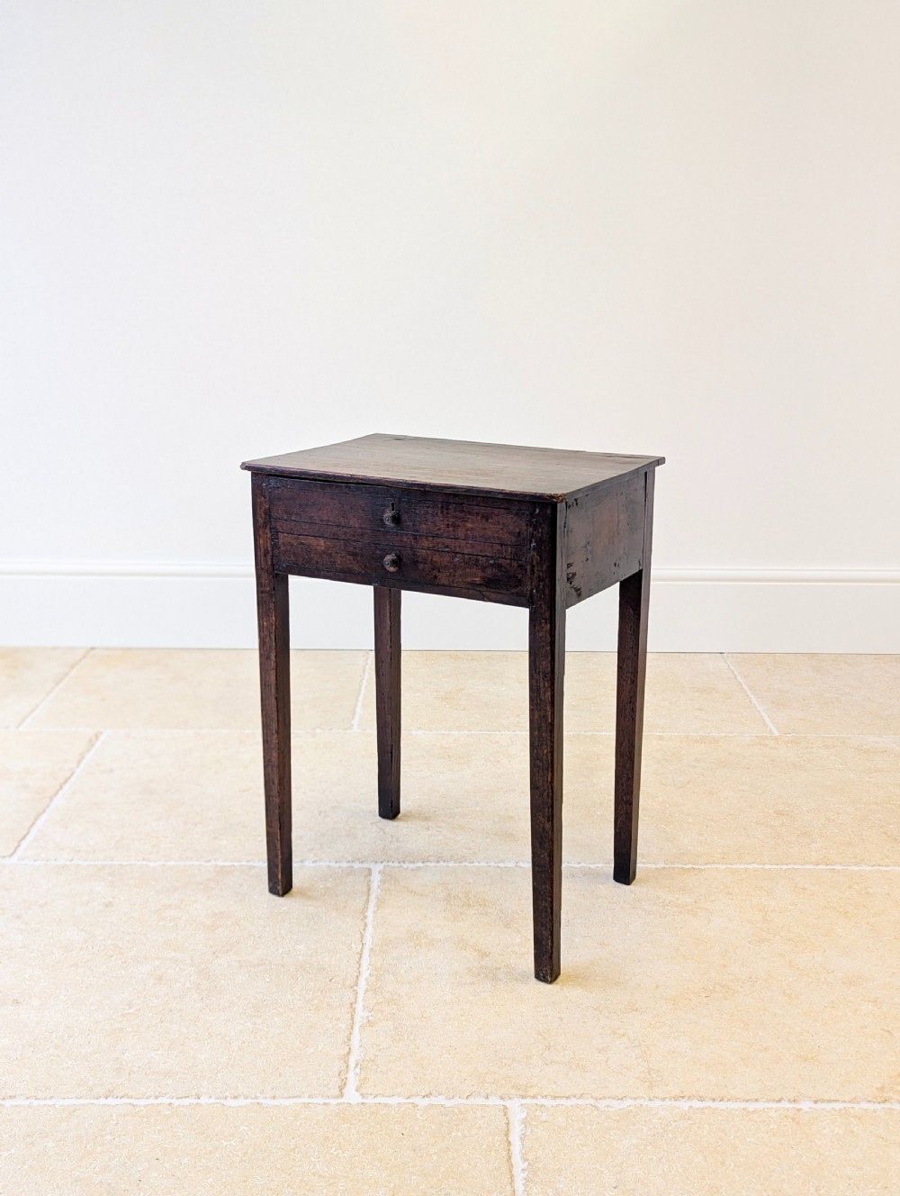 An antique Georgian dark oak work table featuring two drawers, straight square legs, and a rectangular top surface. View IX
