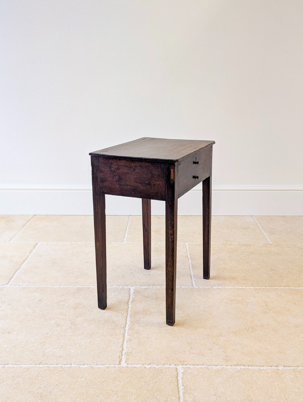 An antique Georgian dark oak work table featuring two drawers, straight square legs, and a rectangular top surface. View XI