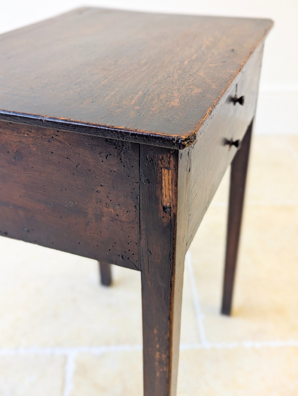 An antique Georgian dark oak work table featuring two drawers, straight square legs, and a rectangular top surface. View XIII