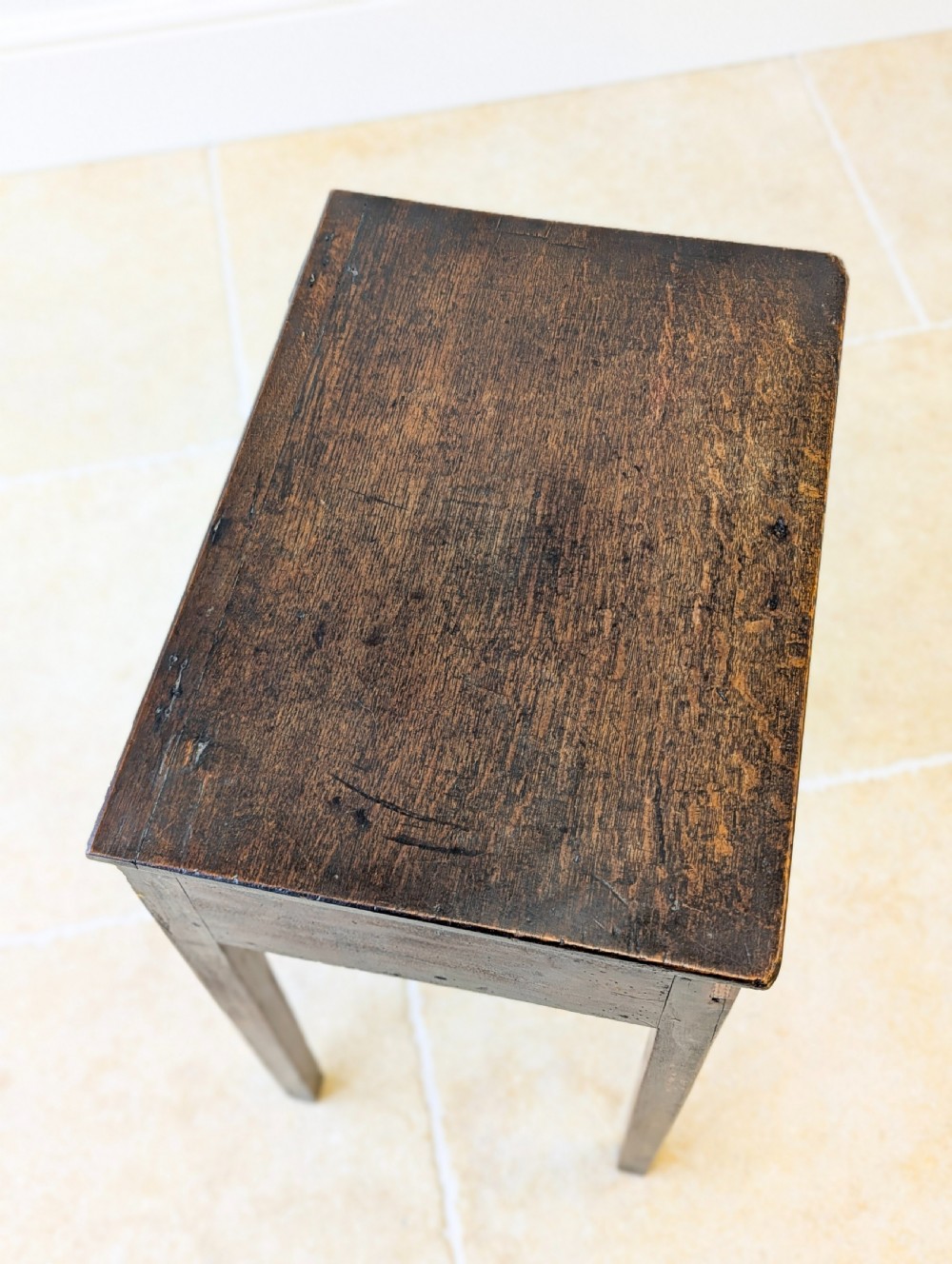 An antique Georgian dark oak work table featuring two drawers, straight square legs, and a rectangular top surface. View XV