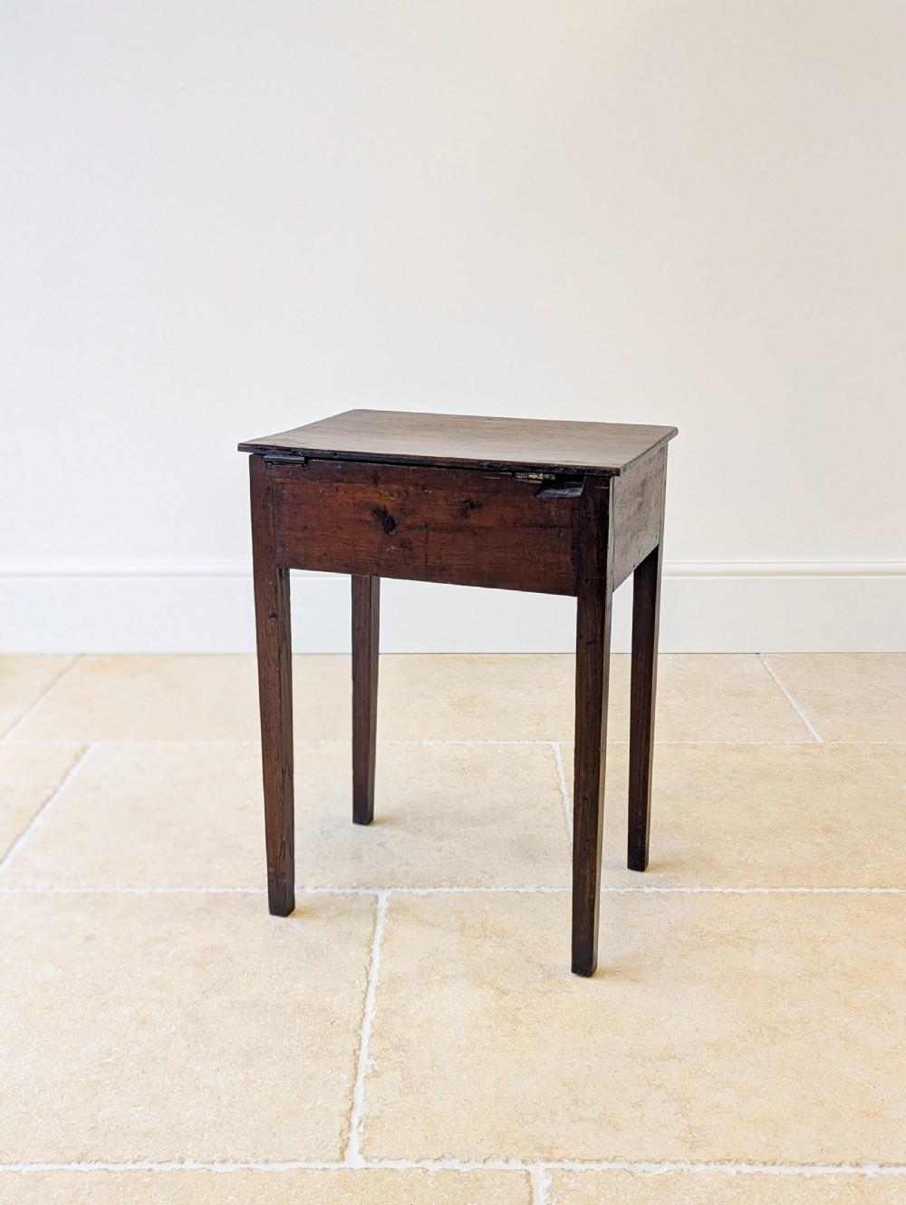 An antique Georgian dark oak work table featuring two drawers, straight square legs, and a rectangular top surface. View XVI