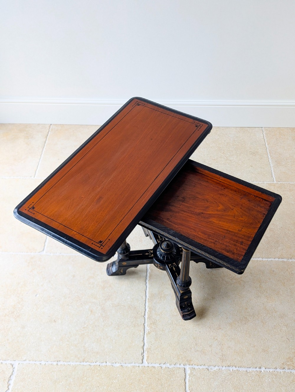 An antique Victorian ebonised and gilt card table with turned twin pedestals and a central finial stretcher. View XIV