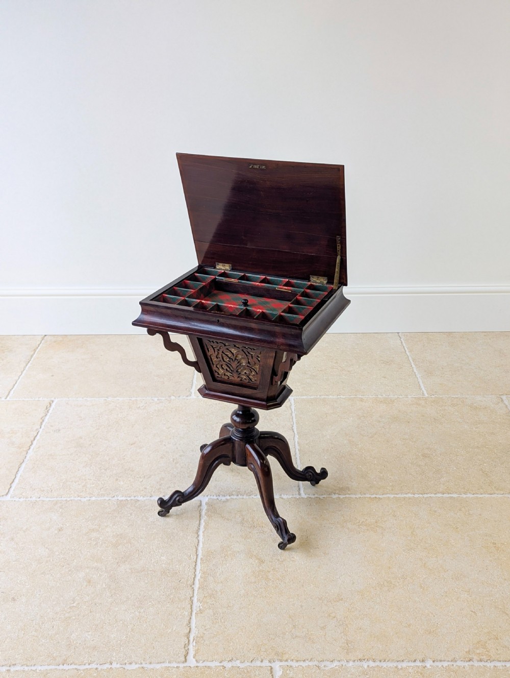 A dark brown rosewood Victorian sewing and reading table featuring an adjustable slanted lid with brass page holders, carved fretwork sides, a turned pedestal column, and four scrolled feet. View III