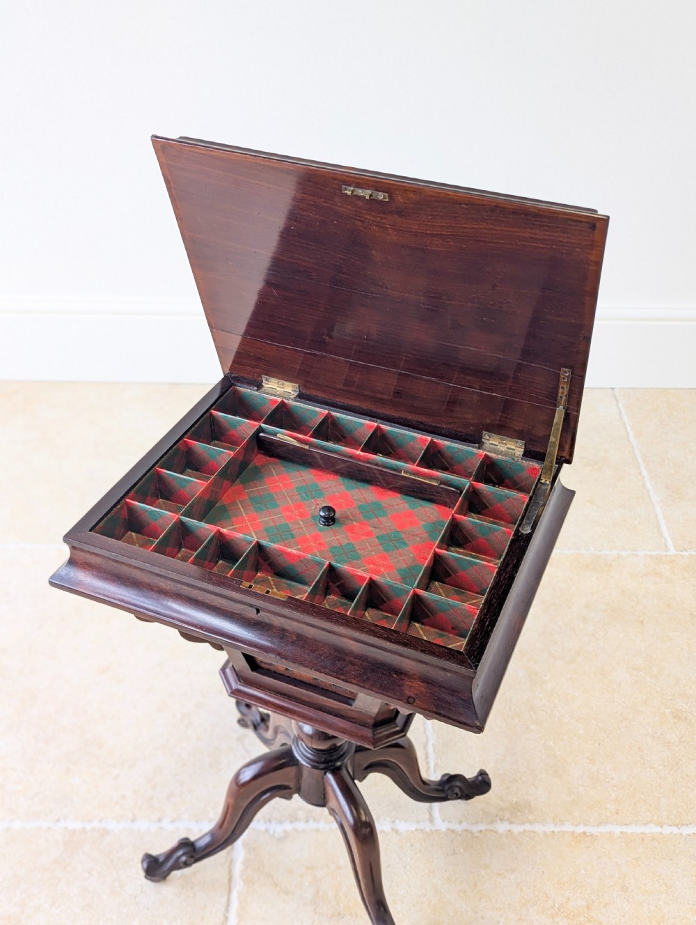 A dark brown rosewood Victorian sewing and reading table featuring an adjustable slanted lid with brass page holders, carved fretwork sides, a turned pedestal column, and four scrolled feet. View VI