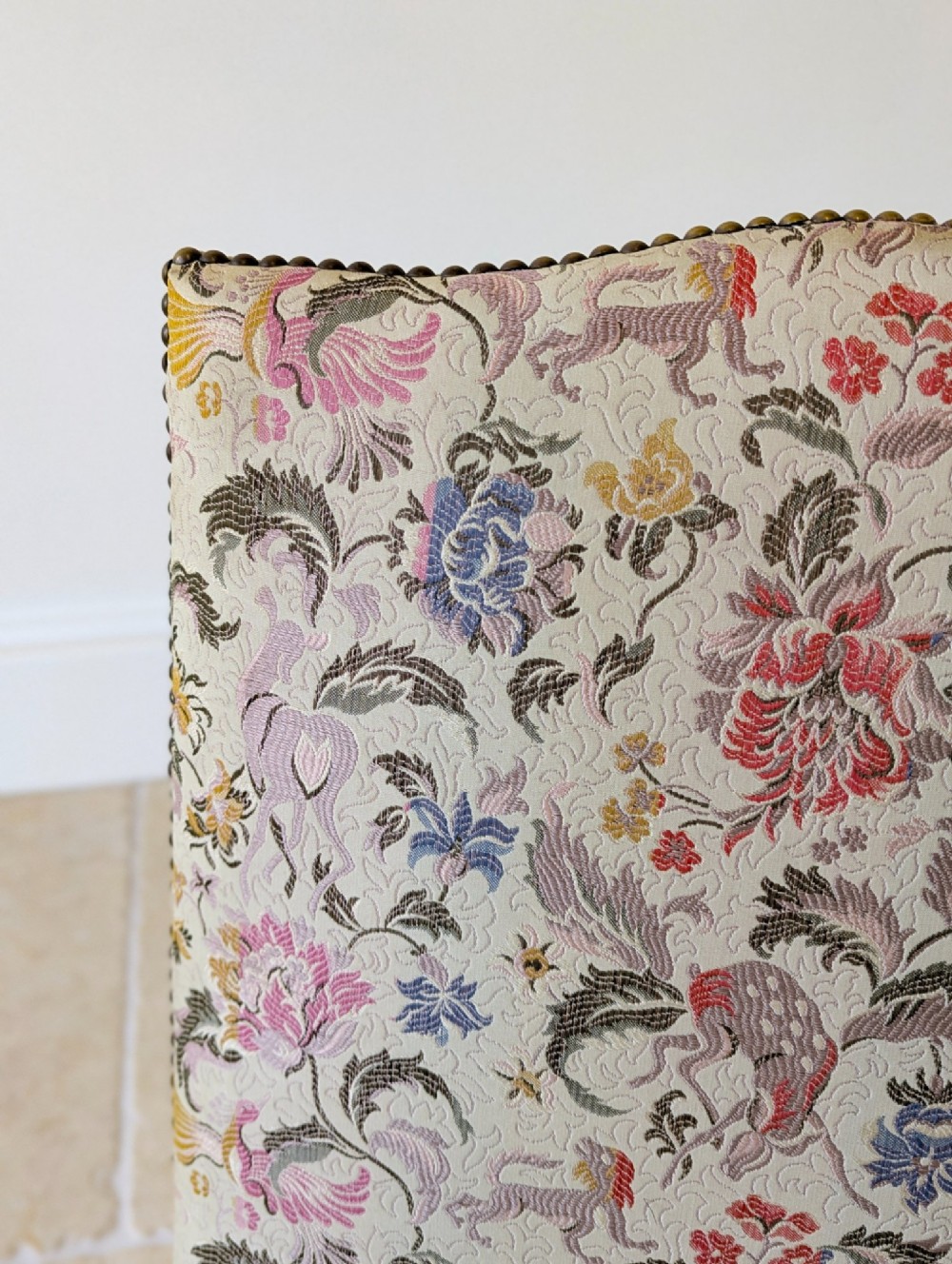 A mid-19th century Victorian side chair with dark mahogany legs on brass castors and dense floral upholstery framed with brass studding. View XI