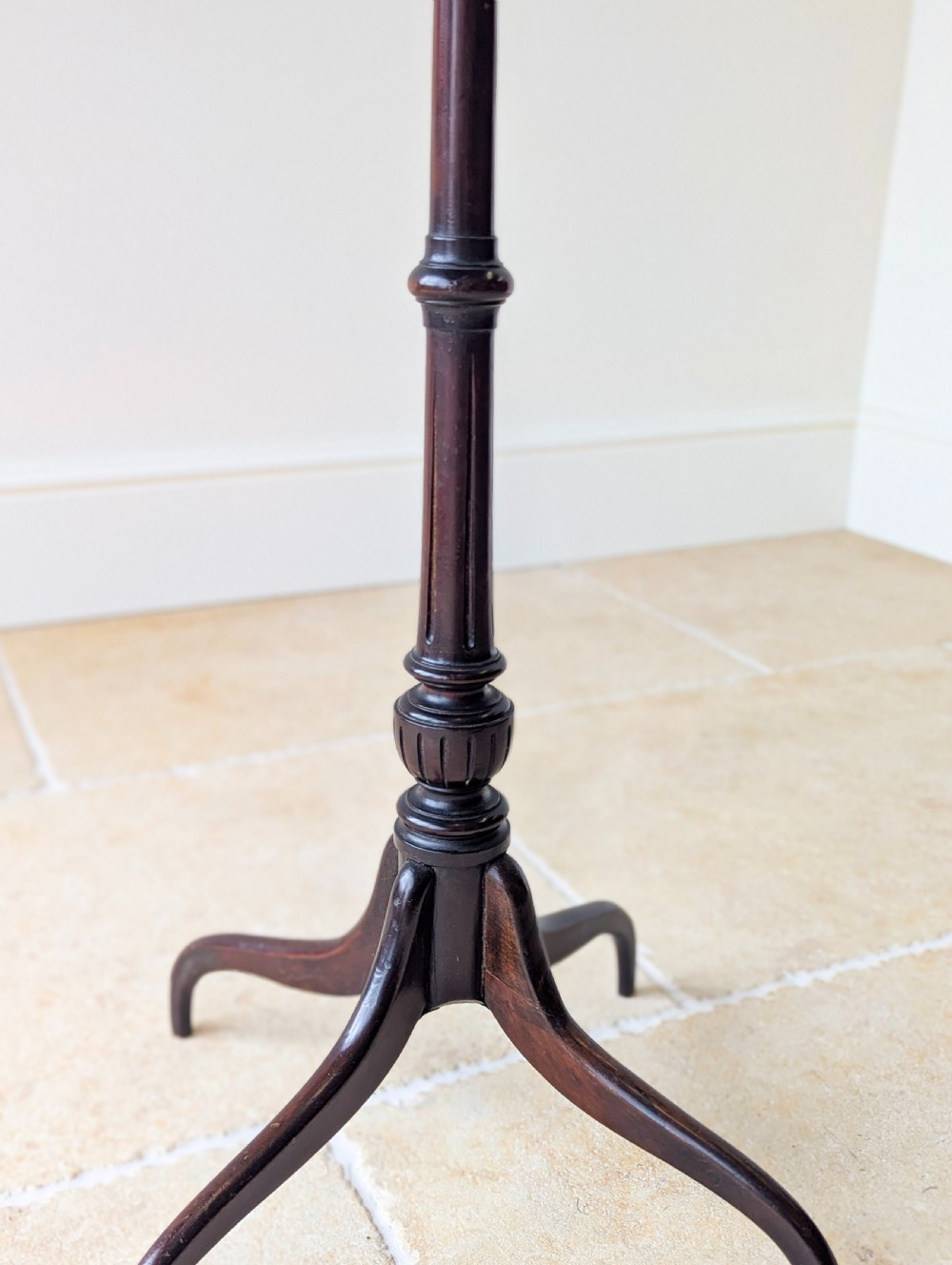 A tall, slender dark walnut torchere featuring a circular flat top, a turned central column, and a sweeping tripod base. View XIII