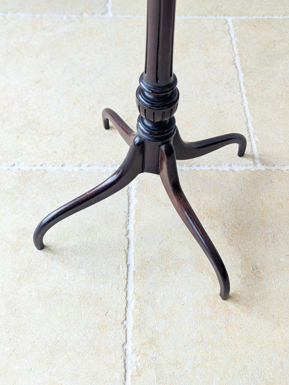 A tall, slender dark walnut torchere featuring a circular flat top, a turned central column, and a sweeping tripod base. View XVI