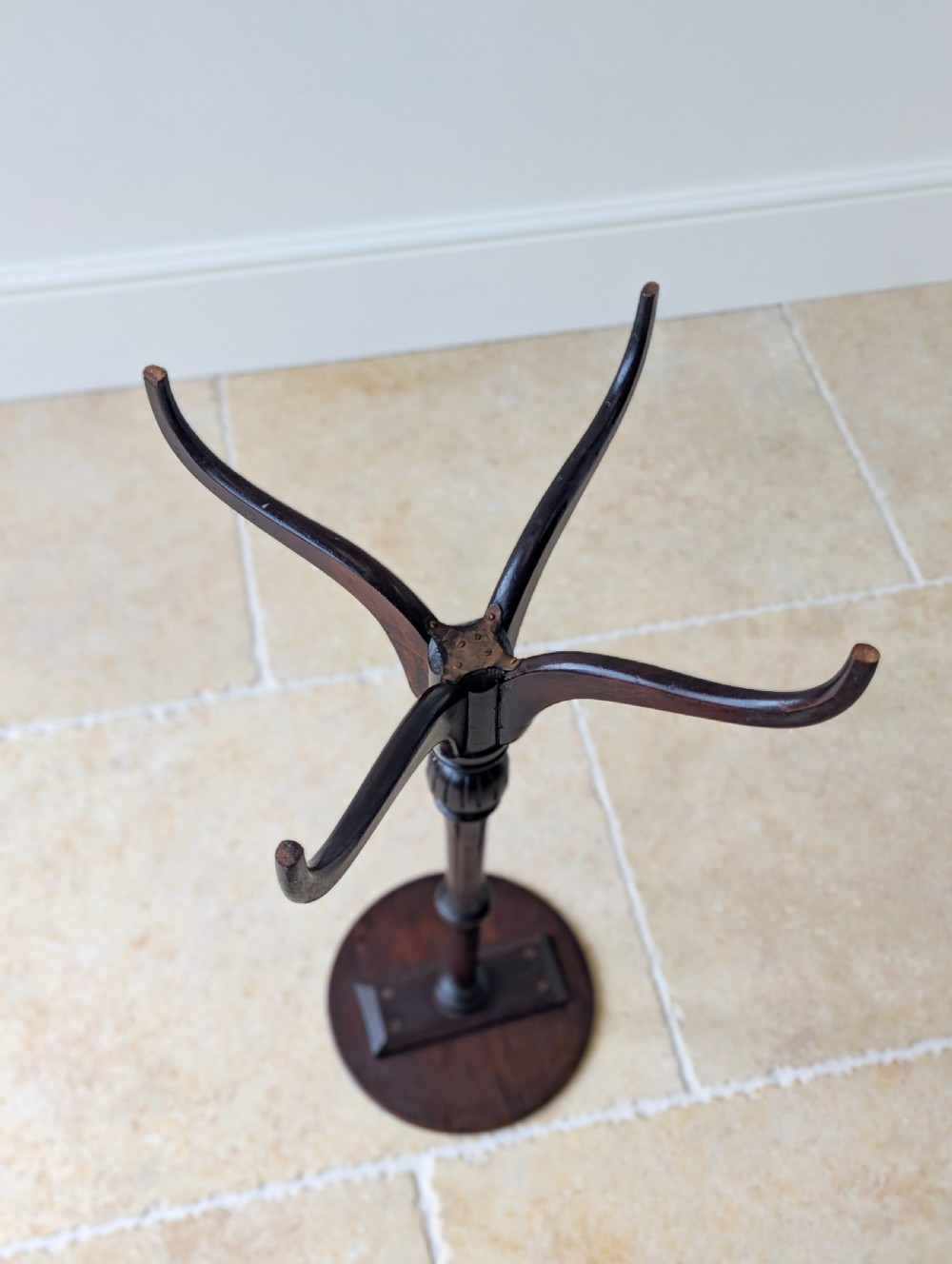 A tall, slender dark walnut torchere featuring a circular flat top, a turned central column, and a sweeping tripod base. View XX
