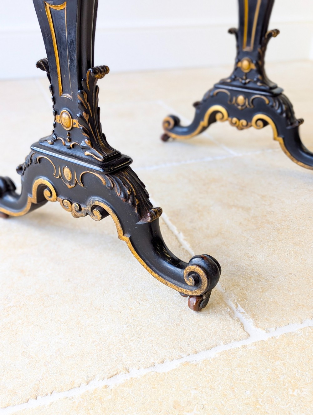 A Victorian ebonised bonheur du jour writing desk featuring gilded accents, a raised superstructure with small drawers, a brass gallery rail, and turned stretcher support. View X