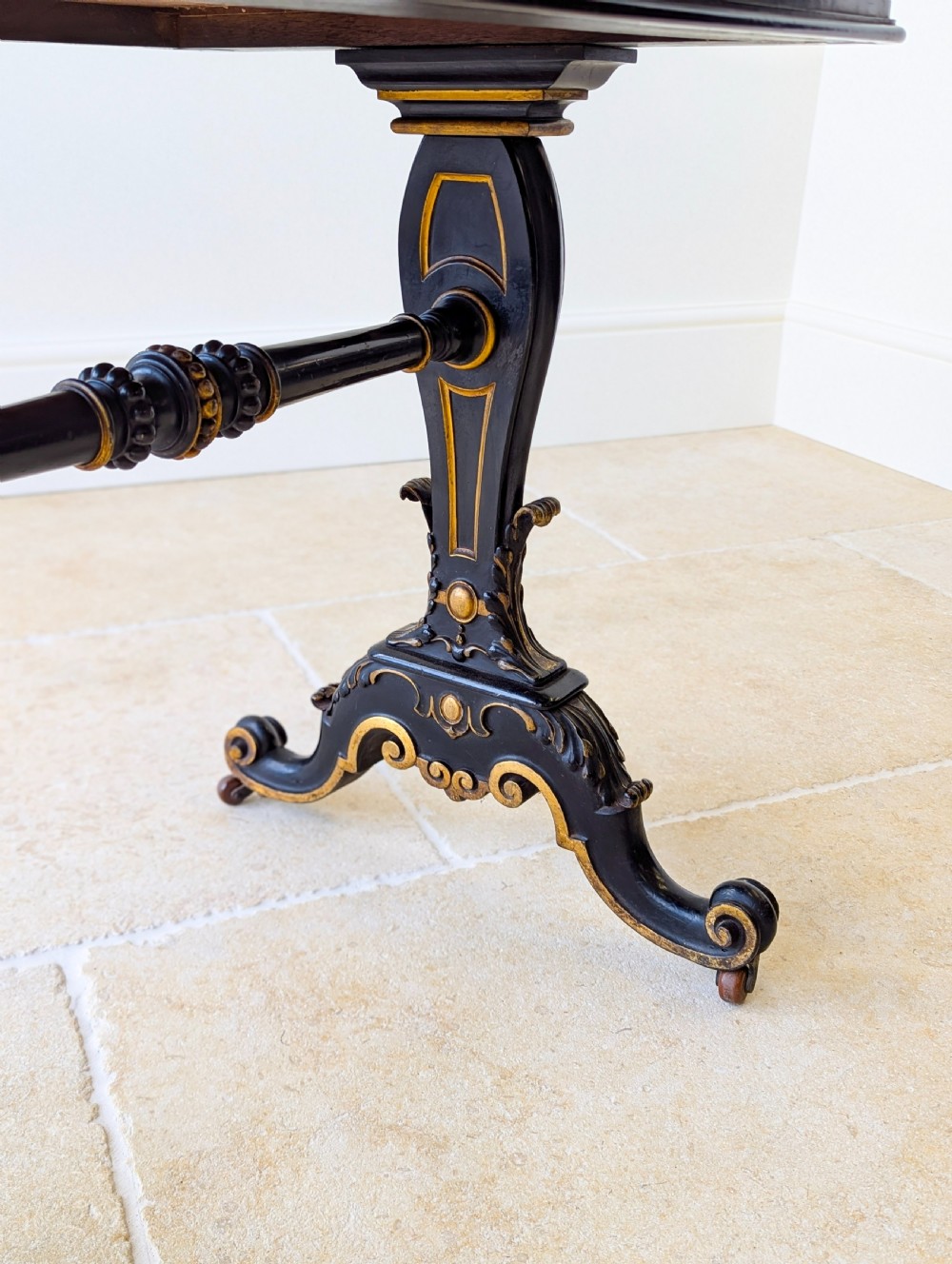 A Victorian ebonised bonheur du jour writing desk featuring gilded accents, a raised superstructure with small drawers, a brass gallery rail, and turned stretcher support. View XIII