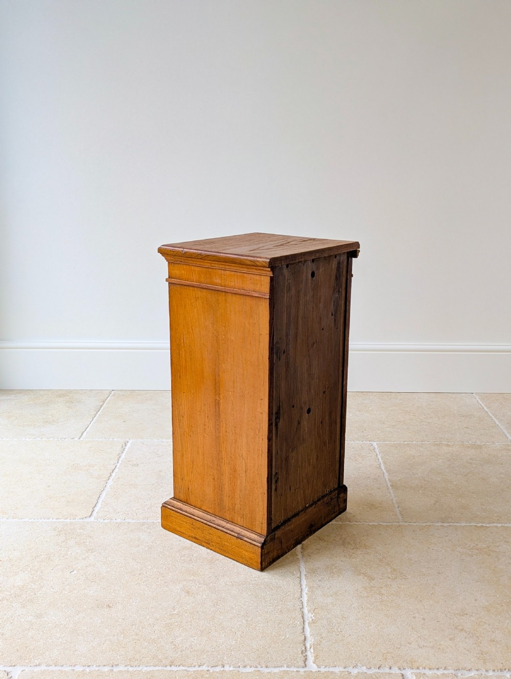 A late Victorian Aesthetic Movement oak bedside cabinet featuring an ebonised inset panel door and drop ring handle. View XIV