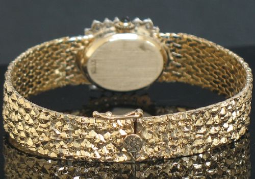 fig 6. STUNNING BAUME AND MERCIER SOLID 14CT GOLD AND DIAMONDS LADIES COCKTAIL WATCH