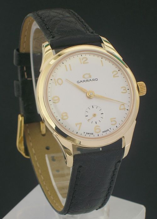 fig 1. OUTSTANDING SOLID 9CT GOLD MENS WATCH BY GARRARD THE CROWN JEWELERS