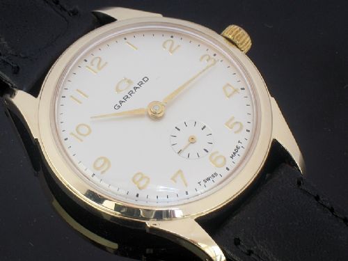fig 5. OUTSTANDING SOLID 9CT GOLD MENS WATCH BY GARRARD THE CROWN JEWELERS