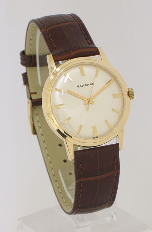 fig 1. OUTSTANDING SOLID 9CT GOLD GARRARD MENS WATCH WITH BOX AND PAPERS