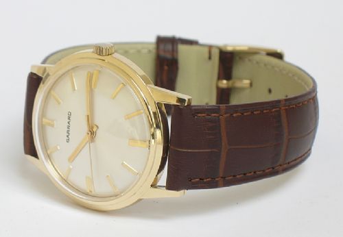 fig 2. OUTSTANDING SOLID 9CT GOLD GARRARD MENS WATCH WITH BOX AND PAPERS