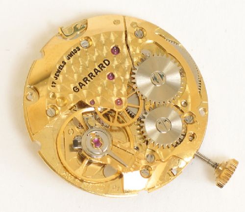 fig 7. SUPERB SOLID 9CT GOLD GARRARD MENS WATCH