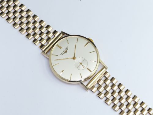 fig 1. .SOLID 9CT GOLD LONGINES CALIBRE 19.4 ON A SOLID 9CT GOLD BRACELET MENS VINTAGE WATCH C1960
