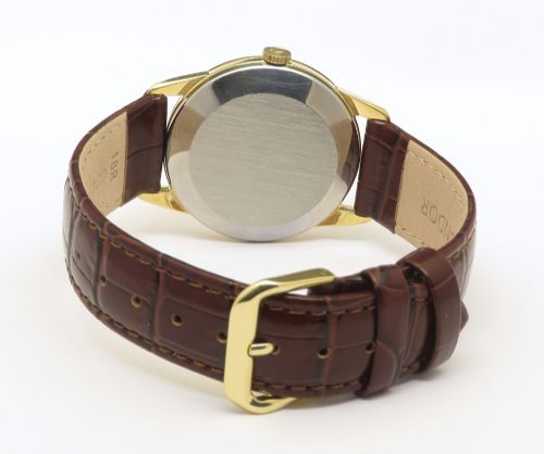 fig 5. A 1960s Omega wristwatch featuring a gold-filled case, a cream dial with gold baton hour markers, and a brown leather strap.
