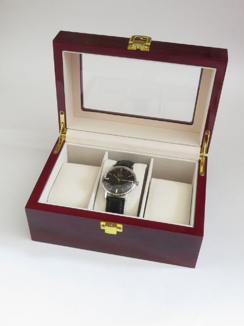 A vintage Omega Seamaster DeVille wristwatch featuring a round stainless steel case, a black dial with silver baton hour markers, and a stitched black leather strap. View IX