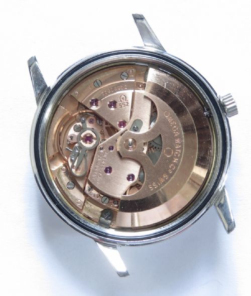 A 1967 stainless steel Omega Seamaster Automatic wristwatch with a silver dial, gold baton hour markers, and a dark green leather strap. View VII
