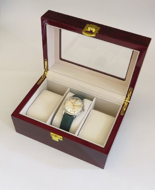 A 1967 stainless steel Omega Seamaster Automatic wristwatch with a silver dial, gold baton hour markers, and a dark green leather strap. View IX