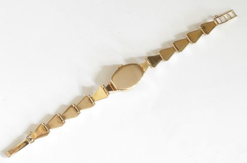 A 9ct yellow gold ladies Tudor Royal cocktail watch featuring a tonneau case and an articulated gold link bracelet. View VI