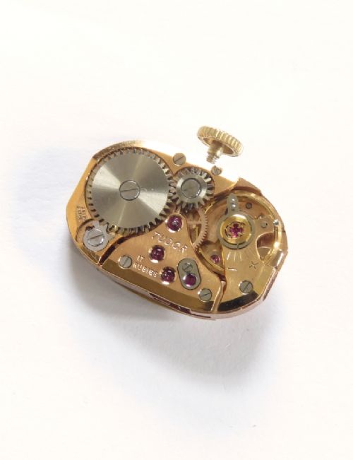 A 9ct yellow gold ladies Tudor Royal cocktail watch featuring a tonneau case and an articulated gold link bracelet. View VIII
