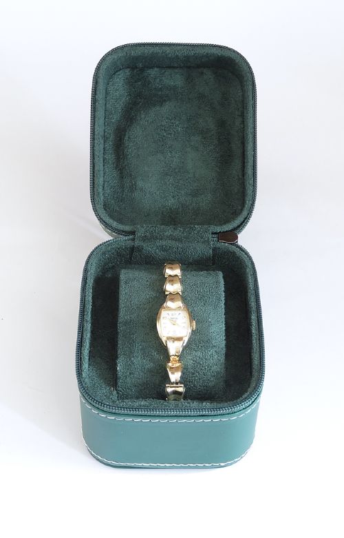 A 9ct yellow gold ladies Tudor Royal cocktail watch featuring a tonneau case and an articulated gold link bracelet. View X