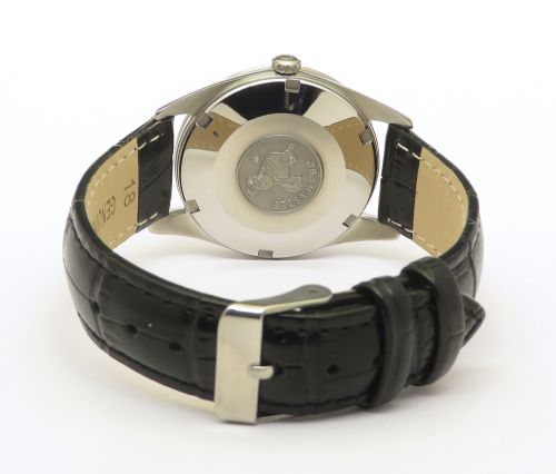 fig 4. A restored 1961 Omega Seamaster automatic wristwatch with a black dial, gold-toned hands and hour markers, date display at three oclock, and a black leather strap.