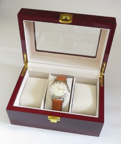 A 1950 vintage Omega Seamaster automatic wristwatch featuring a stainless steel case, cream dial with silver index markers, and a stitched tan leather strap. View VIII