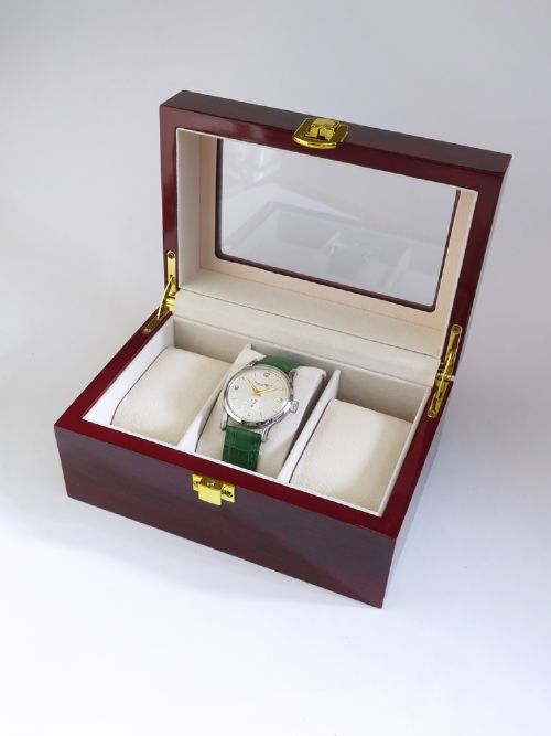 A vintage Swiss wristwatch featuring a stainless steel case, white dial with gold-tone markers, sub-seconds subdial, and a green leather strap. View VIII