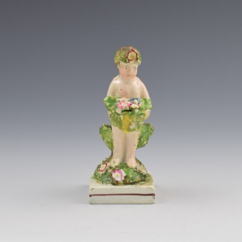 Early Staffordshire Pearlware Figure of a Putto with Basket C.1800