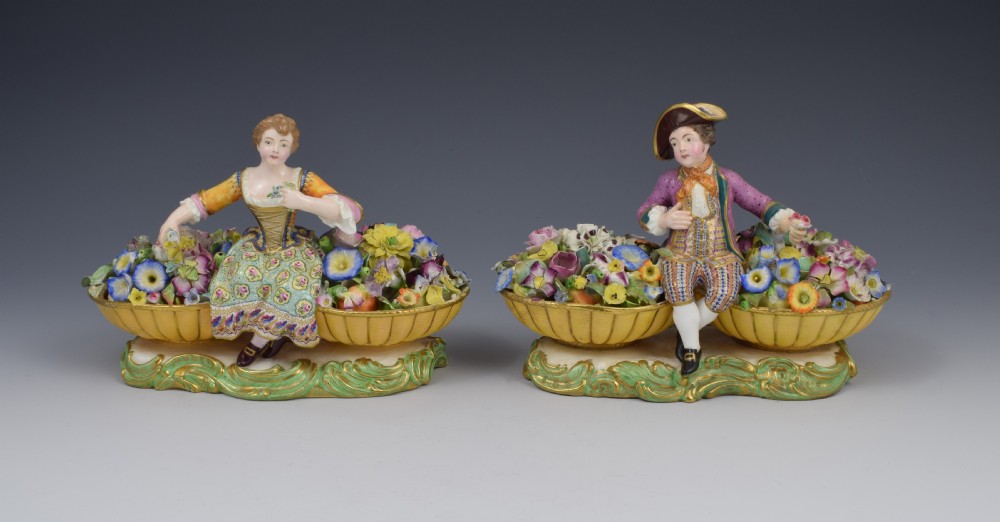 Pair of Minton Figures Sitting Between Baskets Of Flowers Models 58