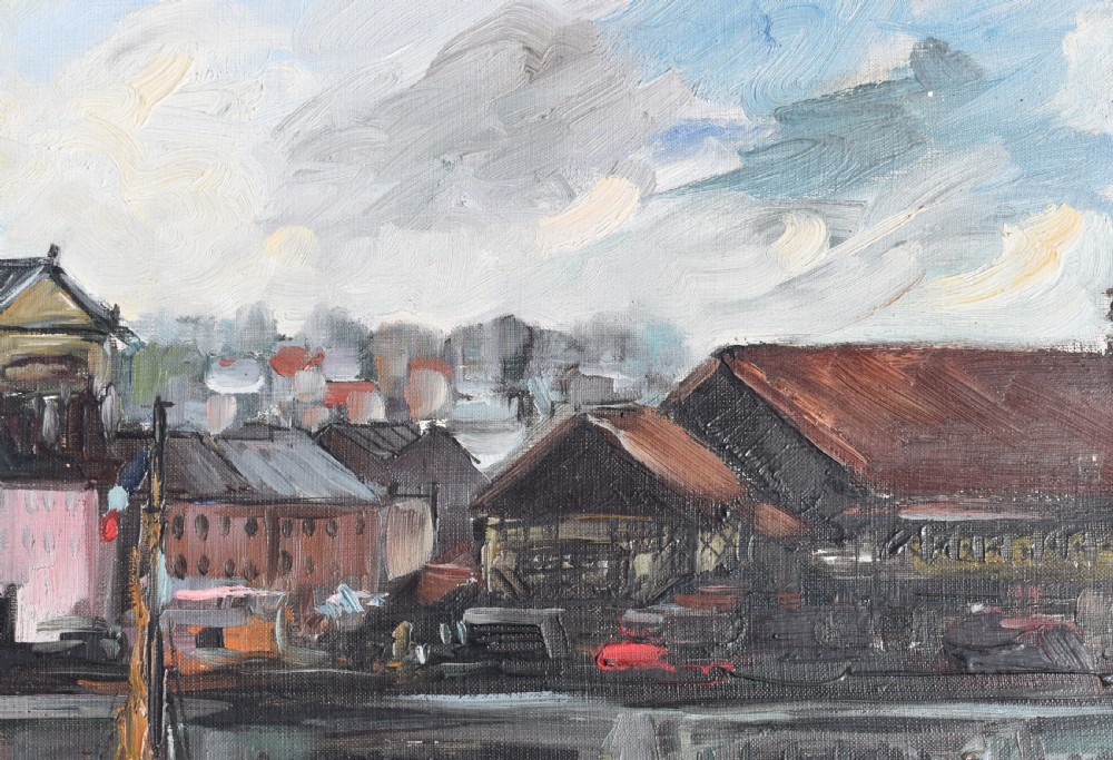 An impressionist oil painting depicting boats anchored in a French harbour against a backdrop of town buildings and a spire, set within an ornate carved frame. View VII