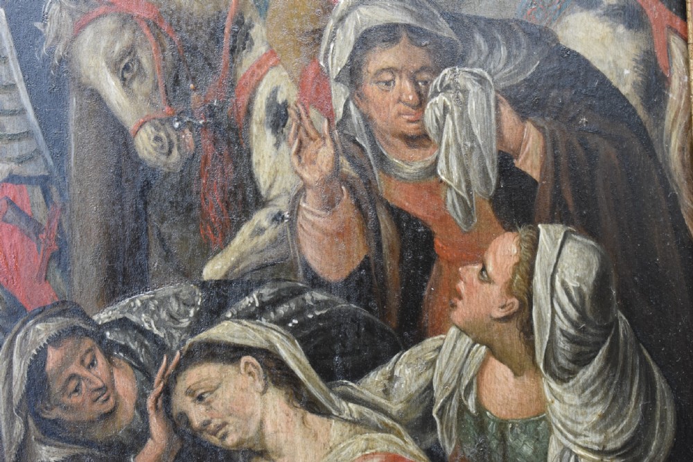 An 18th-century Netherlandish oil painting depicting the Crucifixion of Christ set within an ornate carved giltwood frame. View V