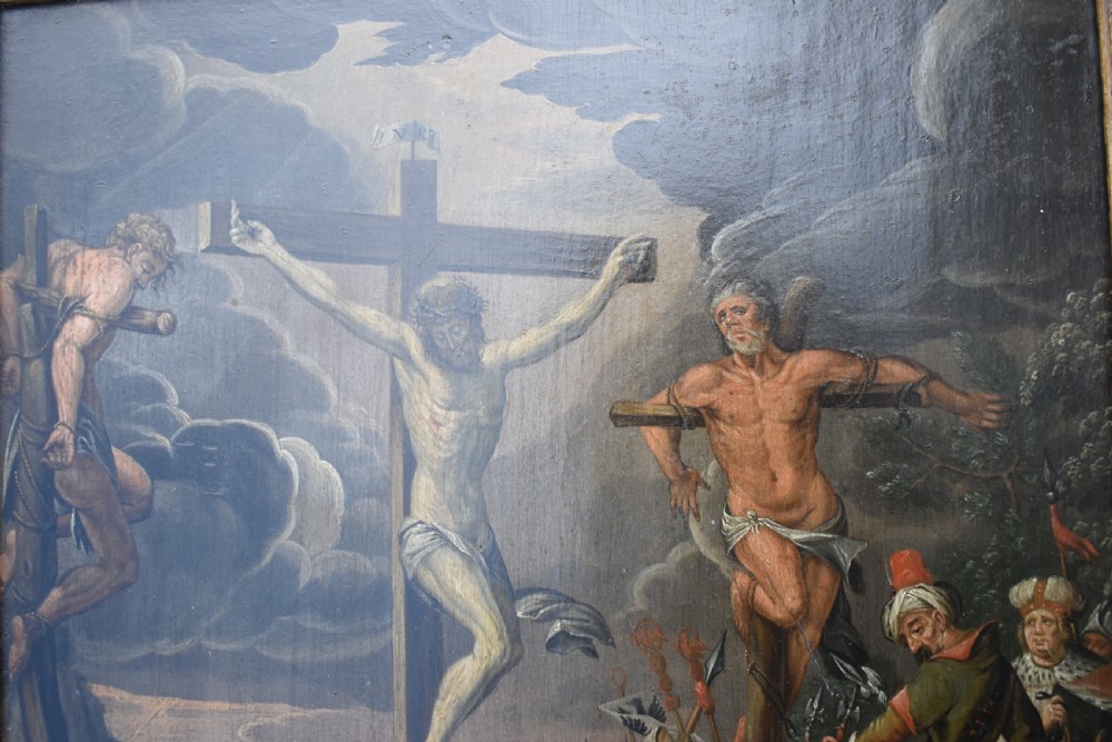 An 18th-century Netherlandish oil painting depicting the Crucifixion of Christ set within an ornate carved giltwood frame. View VI